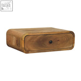 A rustic avora wall-mounted 1-drawer nightstand with oak-ish finish natural wood grain and dark round knob in rounded form factor