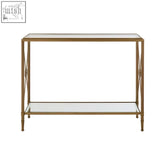 Axis console table with gold finish frame featuring tarnished brass x-shaped legs and two glass shelves console table