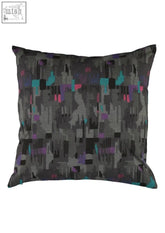 A rectangular dark gray fabric pillow with teal purple and black abstract geometric pattern from back to the future P~S cushions