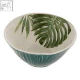 A bali dark green small ceramic salad bowl with teal exterior and white interior featuring a green monstera leaf design