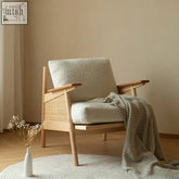 Balino chair cozy mid-century modern armchair with plush off-white upholstery and exposed wood frame with woven cane sides