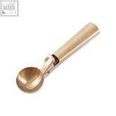 Barron light gold finish ice cream scoop with a polished metal surface and smooth handle for easy scooping