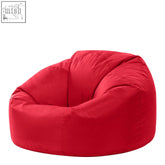 Vibrant red outdoor bean bag with plush fabric and rounded cozy contours perfect for garden seating