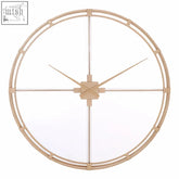 Minimalist gold finish beauly metal wall clock with circular frame and intersecting lines forming a cross design