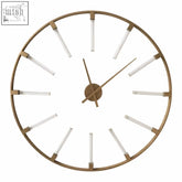 Beauly gold finish round wall clock with minimalist gold frame and slender white stick markers and matching hands