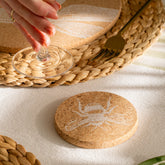 Round natural portuguese cork coaster with white etched bee design and heat resistant surface perfect for drinks