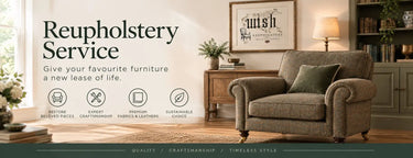 Beige upholstered armchair with rolled arms and dark green cushion.