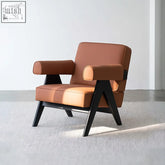Brown bertran armchair with microfiber leather upholstery and black wooden legs in a modern minimalist design