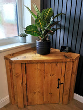 Rustic bespoke wooden corner storage unit with natural finish and black metal hardware perfect for corner storage free delivery