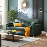 Bh155 three seater sofa bed in emerald green tufted fabric with gold-tone legs and mustard yellow throw pillows