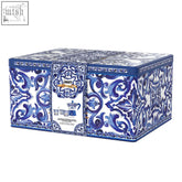 A rectangular metal tea tin with blue and white ceramic patterns in the bialetti x dolce gabbana blue mediterranean gift set