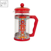 Vibrant red french press with colorful patterns and matching handle from dolce&gabbana’s bialetti blu mediterranean line