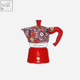 Vibrant red and multicolored patterned bialetti x dolce gabbana sicilian cart moka express with glossy ceramic finish