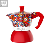 Vibrant red dolce&gabbana moka induction espresso maker with colorful floral and geometric patterned ceramic body