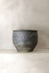 A rustic dark gray ceramic planter with textured surface and beaded rim from big old grey asian pots l018