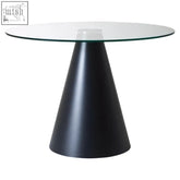 Black metal dining table with a clear glass top supported by a sleek black conical base