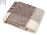 A soft block check pure new wool throw in brown beige cream with fringed edges measuring 183cm including fringe