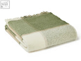 Folded block check wool throw in olive with green and cream checks and fringed edges made from pure new wool