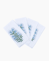 White cotton napkins with hand blocked blue and green floral embroidery set of 4 perfect for dining use