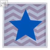 A blue star led light box featuring a bold blue star on light purple and white chevron stripes wall art