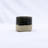 Blunero picollo handmade ceramic milled espresso mug with speckled black glaze and unglazed beige base