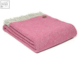 A soft pink boa pure new wool throw with light gray fringe and green tag perfect for blanket size guide use