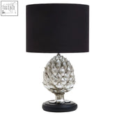 Silver artichoke table lamp with a black cylindrical shade perfect for stylish boho table lighting