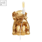 Golden elephant table lamp with vintage-style bulb perfect for boho decor and cozy lighting