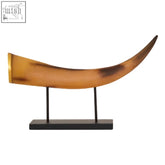 Golden-brown natural horn ornament displayed on a black metal stand as a boho large horn ornament