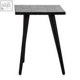 Black metal boho side table with textured buffalo bone inlay top and acacia wood legs for stylish living spaces