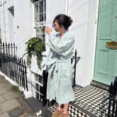 A light mint green bolney eucalyptus linen kimono robe with long sleeves and a tied waist perfect for lounging