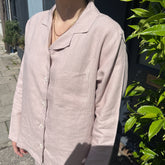 A soft blush-colored linen button-up shirt with classic collar and front pocket from bolney mauve mist wide leg pyjamas