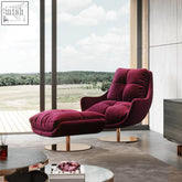 Deep burgundy velvet bonnet swivel lounge chair with matching ottoman on gold-toned swivel metal bases