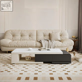 Cream-colored tufted sofa with gold-tone legs paired with bonnie coffee table black and white extendable design