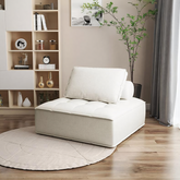Cream-colored tufted leather borcem single sofa with plush cushion and matching backrest for comfy lounging