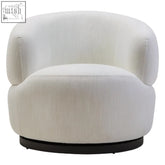 Cream-colored upholstered bordo textured curved swivel chair with cushioned design and black circular base