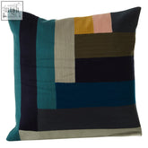 A bosie ozella assorted stripe cushion with bold teal navy olive beige mustard and soft pink stripes on a square throw pillow