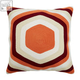 Bosie ozella hexagonal print cushion with bold concentric hexagonal print in orange cream and deep red colors