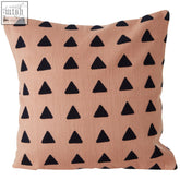 A soft peach bosie ozella pink cushion with black embroidered triangle pattern perfect as a pink cushion accent