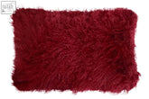 A plush bosie real mongolian fur maroon rectangular cushion with soft shaggy texture and slightly frayed edges
