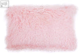 A soft fluffy pink rectangular cushion made of bosie real mongolian fur with a plush textured surface