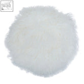 White fluffy round cushion made of soft mongolian lamb fur perfect for cozy home decor