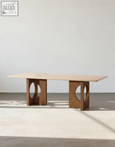 Boucheron dining table with a light beige travertine marble top and grooved solid wood legs for your dining area