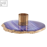 A sleek purple agata blue candle holder with a polished gold brass center for stylish home decor