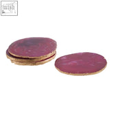 Set of four bowerbird agata coasters with agate pink textured surface and warm metallic edging with wood edges