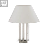 Silver metallic brendan table lamp with white fabric shade and vertical slatted base perfect for cozy lighting