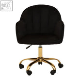 Black velvet home office chair with a gold base and casters perfect for stylish home office setups