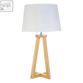 Brett pine wood table lamp with white fabric shade and light-colored pine wood tripod base for a wood table setup