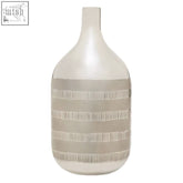 A sleek matte white ceramic briella glass vase with textured beige stripes in silver and copper accents