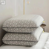 Stacked gray brightr eclipse adjustable firm memory foam pillows with subtle geometric pattern and dark piping